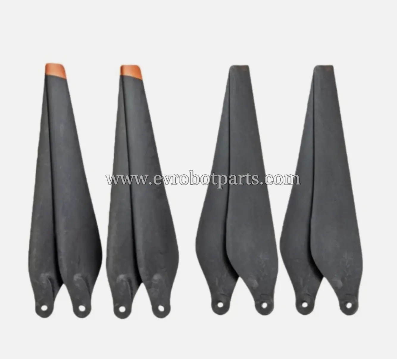 Four black drone propellers with two featuring orange tips arranged in two pairs for drone propulsion system